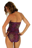 Back view of tan through high waisted bikini bottoms in purple Safari print.