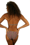 Back of scrunch butt tan through bikini bottoms -- pink Toucan.