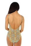 Amira showing moderate back of yellow Carnival traditional tank from Lifestyles Direct Tan Through Swimwear.