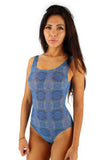 Tan through tank style swimwear with blue Serpent print.