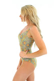 Side view of tan through CD underwire support tank swimsuit in yellow Carnival print.