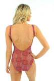 Back image of pink Serpent tan through underwire swimsuit.