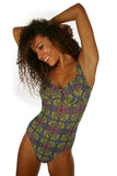 Tan through CD underwire swimsuit with green Heat print.