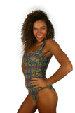 Side of tan through swimsuit with green Heat print and CD underwire support cups.