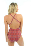 Pink Serpent tan through adjustable strap structured top swimsuit -- back view.