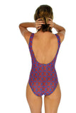 Back view of tan through swimwear with structured cups and blue Hibiscus print.
