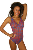 Jordan modeling tan through structured swimwear for women in blue Hibiscus.
