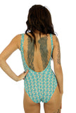 Back view of tan through C-D underwire womens swimsuit with Conch print.