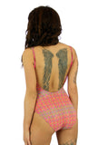 Tan through womens swimsuit with adjustable straps and underwire cups in pink Forever print.