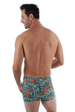Back of tan through men's bike shorts with blue Morea print.