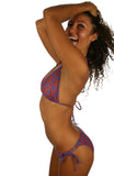 Blue and red Hibiscus print on tan through bikini with string ties.