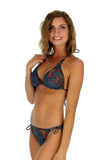 Cameo shows side of double tie string bikini bottoms -- multicolor Safari tan through swimwear.