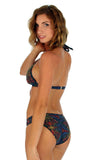 Scrunch butt tan through bikini bottoms in multicolor Safari pattern.