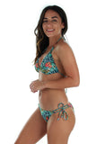 Side view of tan through string bikini top in blue Morea  print.