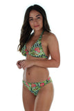Side view -- green Morea print on tan through halter bikini top.